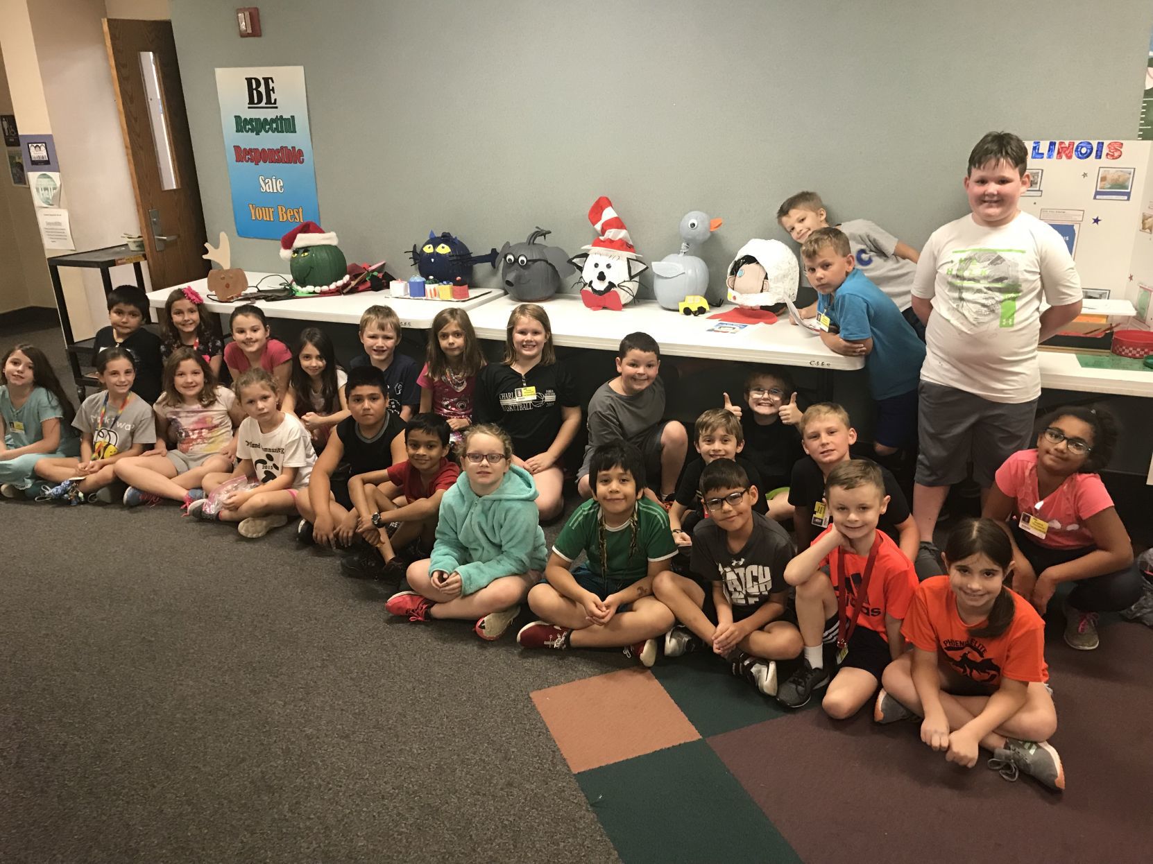 Students decorate pumpkins for food pantry